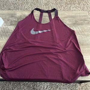 Nike tank top, low cut back.